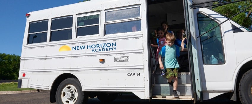 School-age children on New Horizon Academy school bus