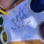 Child enjoying bubble art painting activity