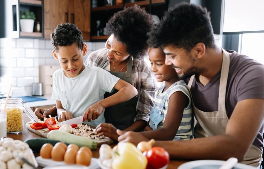 Family preparing a variety of healthy, bright, and colorful vegetables to eat