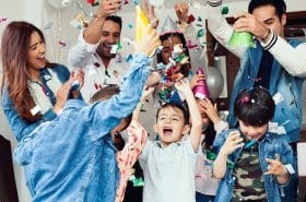Family celebrating New Year's Eve with young children