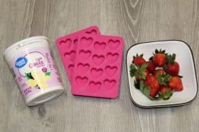 Greek yogurt, Valentine's Day heart shape molds, and strawberries