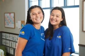 Two New Horizon Academy teachers in a childcare classroom