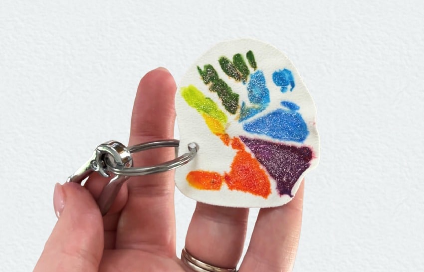 Homemade keychain with a child's colorful handprint on it