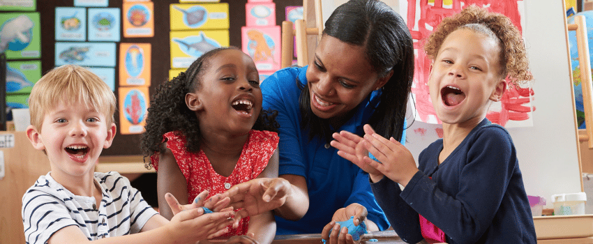 Daycare teacher playing with children