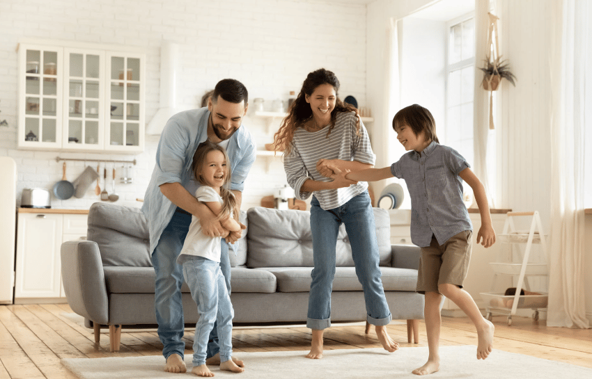 Family dancing in living room