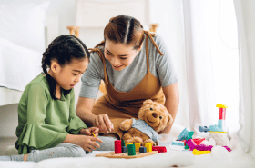 Parent playing educational games with child to enhance cognitive development