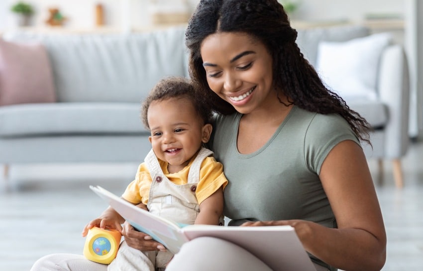 Mother reading a classic board book to her infant son