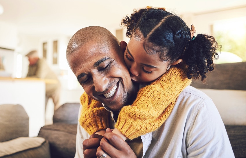 Grateful child hugging her dad