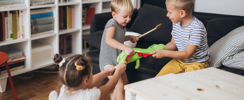 Siblings arguing over a toy