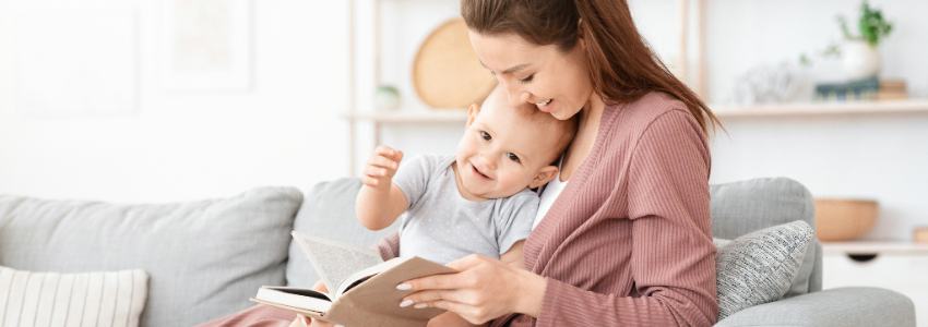 Parent and baby bonding while reading a book