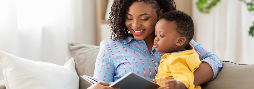 Parent and infant reading on couch