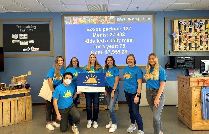 New Horizon Academy marketing team volunteering at Feed My Starving Children in Chanhassen, Minnesota