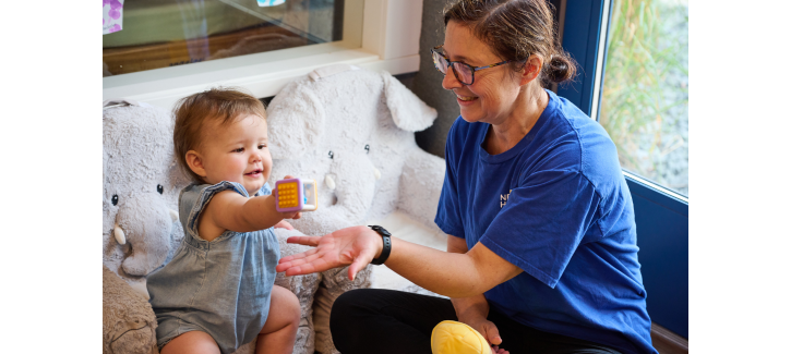http://Infant%20teacher%20playing%20with%20baby%20at%20daycare