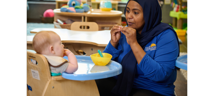 http://Teacher%20communicating%20with%20infant%20child%20through%20sign%20language%20to%20help%20them%20build%20language%20and%20communication%20skills