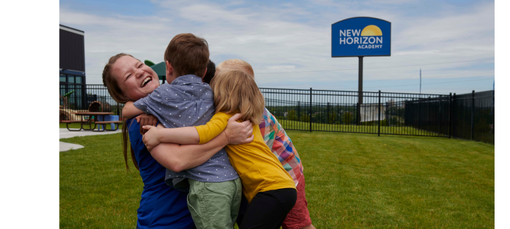 http://Children%20giving%20their%20teacher%20a%20big%20group%20hug%20at%20daycare